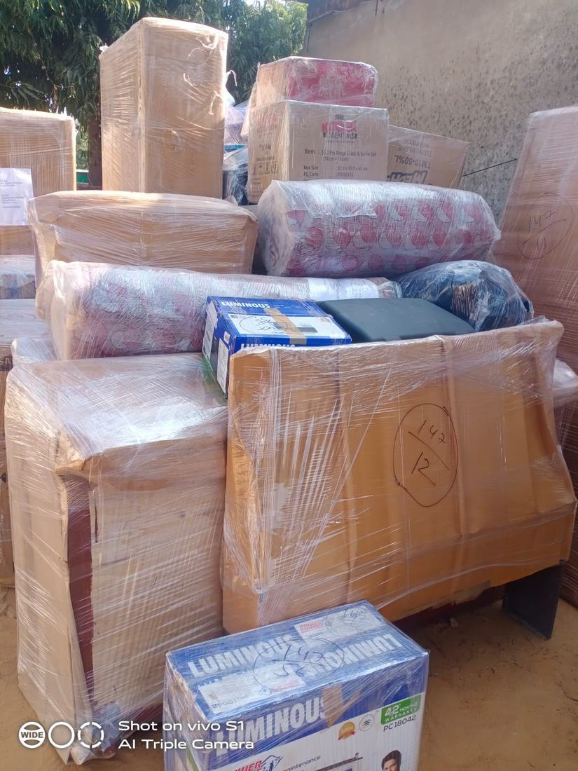Packed household items marked with inventory numbers