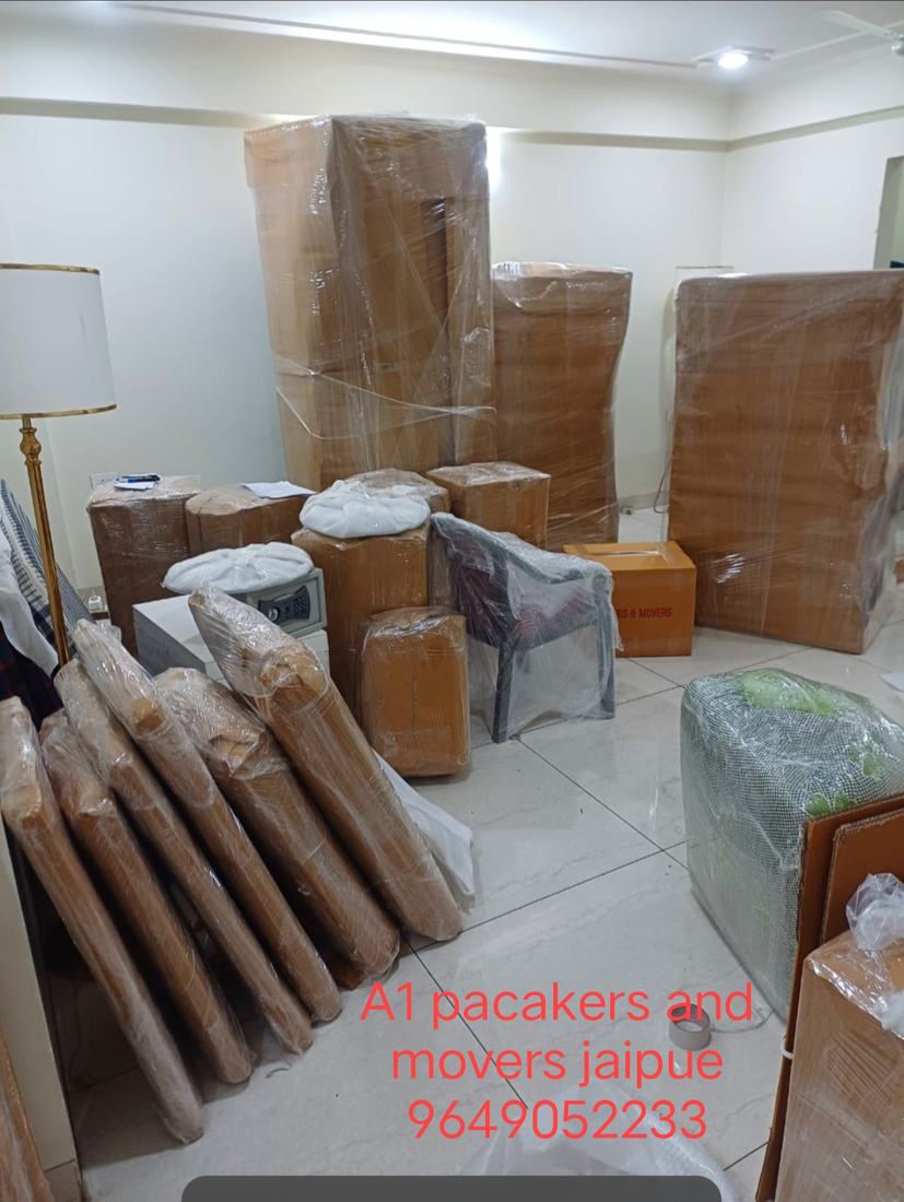 A full living room of furniture wrapped and packed for a home shift